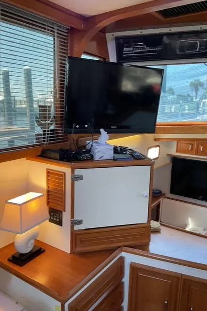Slide: The Image of 1988 Jefferson 42 Sundeck interior with TV, lamp, and wooden cabinetry. - 34