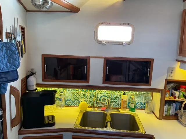 Slide: The Image of 1988 Jefferson 42 Sundeck kitchen with dual sink, coffee maker, and decorative backsplash. - 36