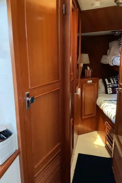 Slide: The Image of 1988 Jefferson 42 Sundeck interior with wooden cabinetry and cozy sleeping area. - 37