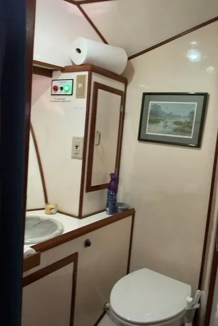 Slide: The Image of Bathroom interior of 1988 Jefferson 42 Sundeck yacht with sink and toilet. - 38