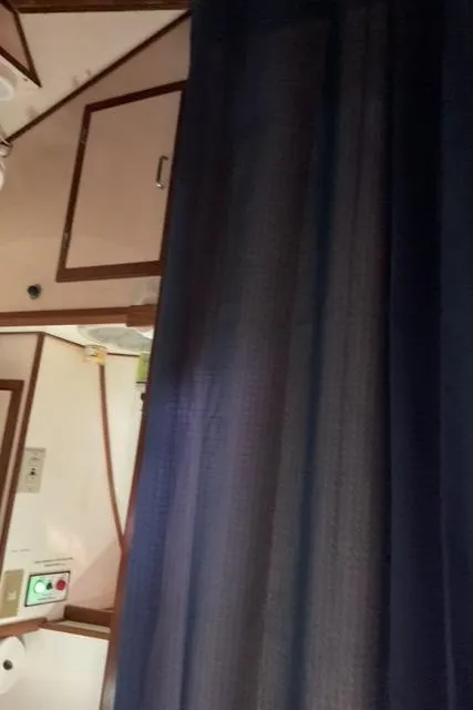 Slide: The Image of Interior view of 1988 Jefferson 42 Sundeck yacht with curtain and cabinetry. - 39