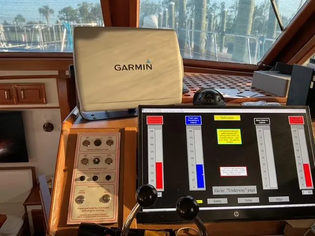 Slide: The Image of Control panel of a 1988 Jefferson 42 Sundeck with Garmin navigation system. - 8