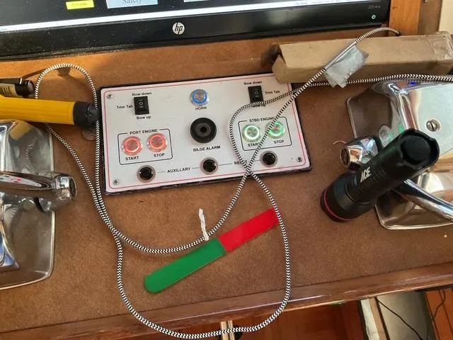 Slide: The Image of Control panel of a 1988 Jefferson 42 Sundeck boat with various switches and tools. - 9