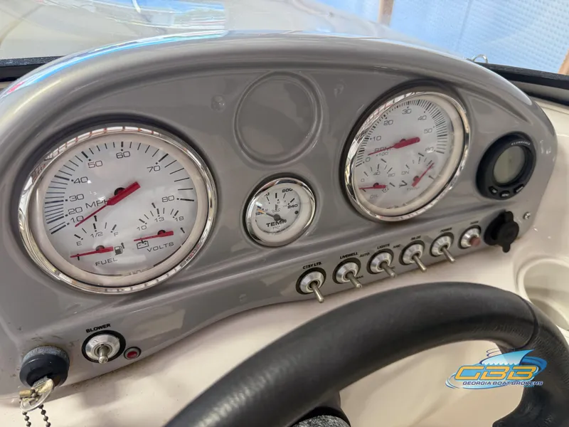 Slide: The Image of Dashboard of a 2007 Tahoe Q7i SF boat with gauges and controls. - 14