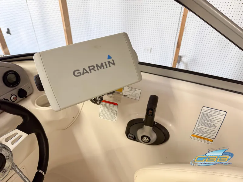 Slide: The Image of 2007 Tahoe Q7i SF boat cockpit with Garmin GPS and steering controls. - 15