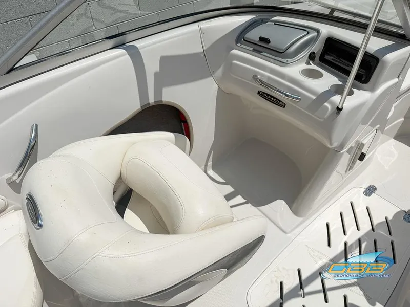 Slide: The Image of 2007 Tahoe Q7i SF boat interior with white seating and dashboard. - 20