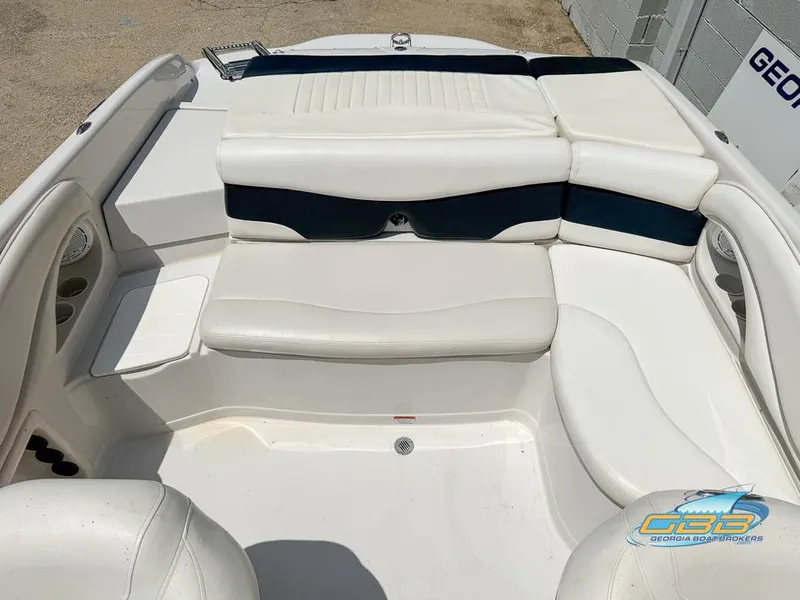 Slide: The Image of 2007 Tahoe Q7i SF boat interior with white seating and storage compartments. - 21