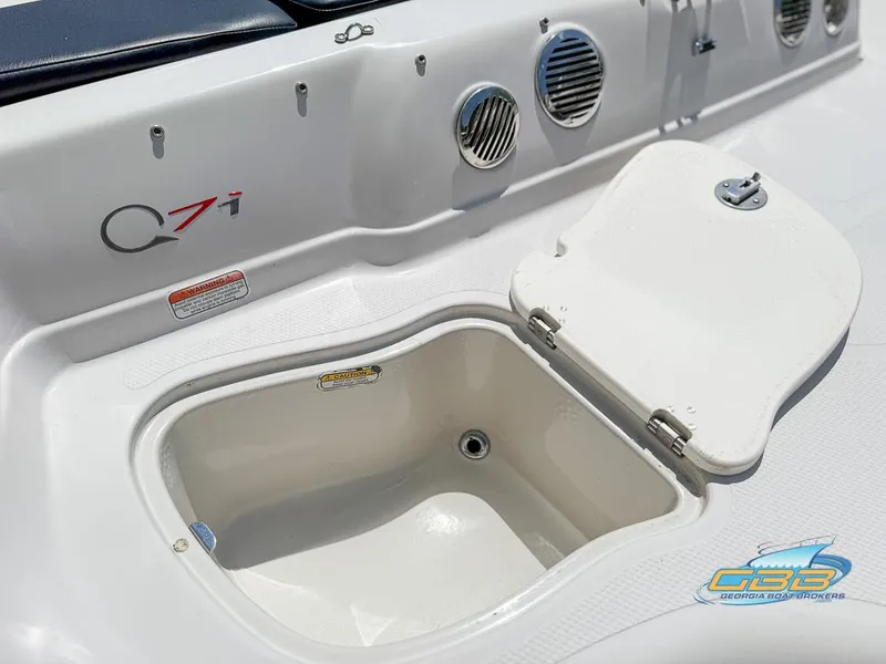 Slide: The Image of 2007 Tahoe Q7i SF boat storage compartment with open lid, showcasing interior details. - 23