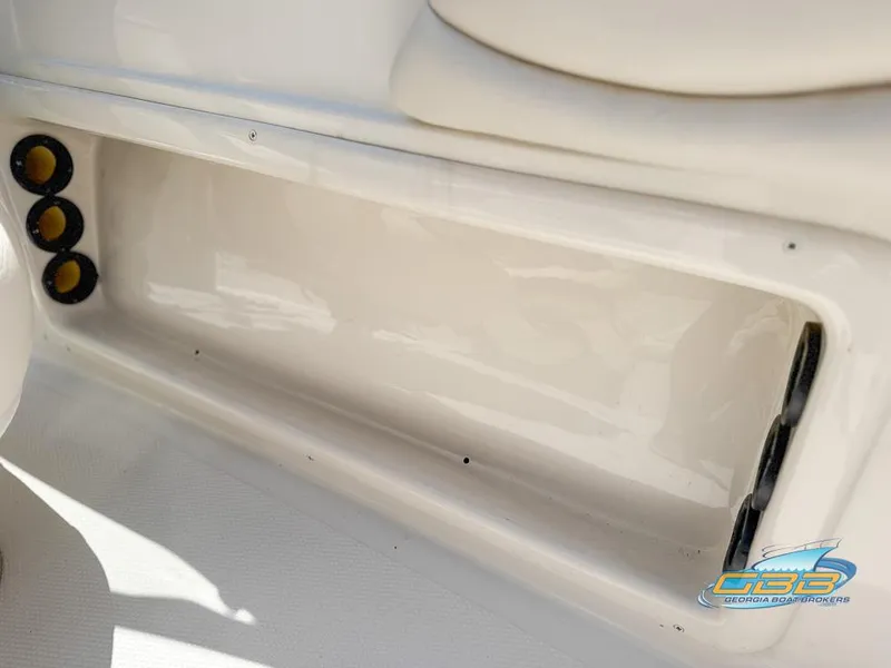 Slide: The Image of 2007 Tahoe Q7i SF boat interior storage compartment with cup holders. - 25