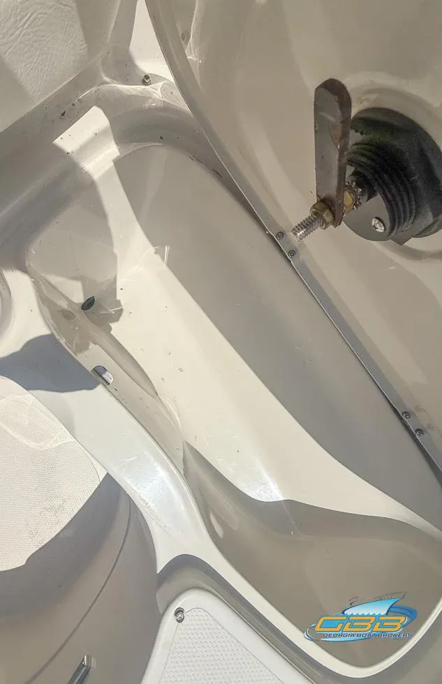 Slide: The Image of 2007 Tahoe Q7i SF boat storage compartment with open lid and visible latch mechanism. - 30