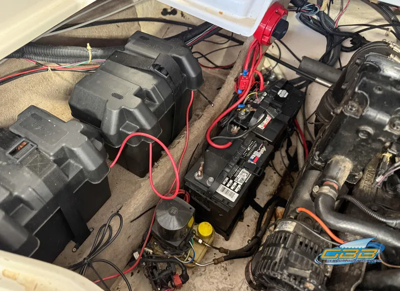 Slide: The Image of 2007 Tahoe Q7i SF boat engine compartment with batteries and wiring. - 34