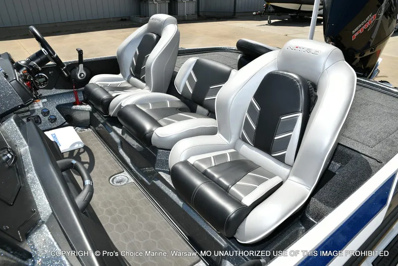 Slide: The Image of 2024 Nitro Z21 XL Pro boat interior with sleek, modern seating and dashboard design. - 15