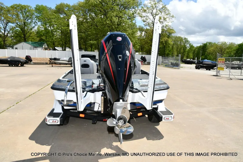 Slide: The Image of 2024 Nitro Z21 XL Pro boat with powerful outboard motor, parked outdoors. - 16
