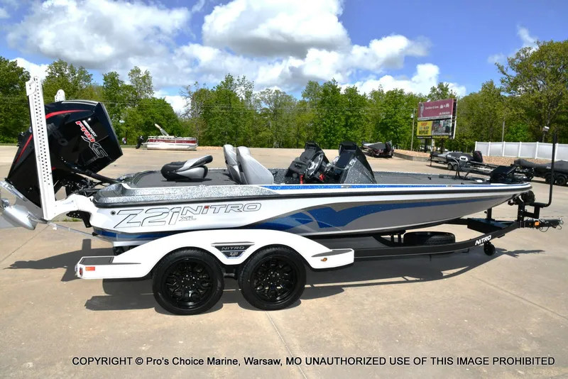 Slide: The Image of 2024 Nitro Z21 XL Pro boat on trailer, side view, outdoors. - 20