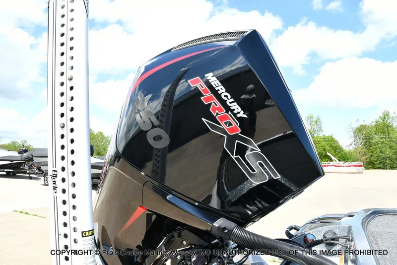Slide: The Image of 2024 Nitro Z21 XL Pro with Mercury Pro XS engine, outdoors on a sunny day. - 21