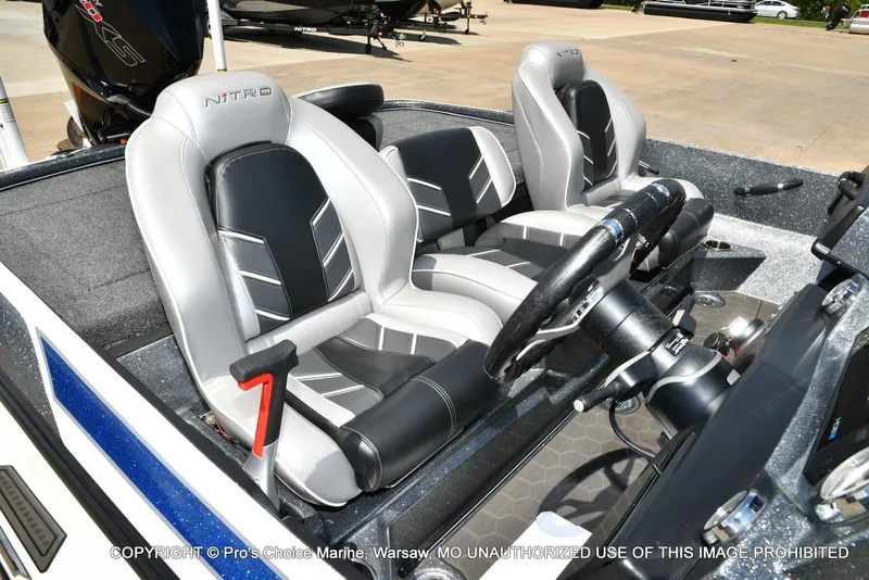 Slide: The Image of 2024 Nitro Z21 XL Pro boat interior with sleek seating and modern steering console. - 37