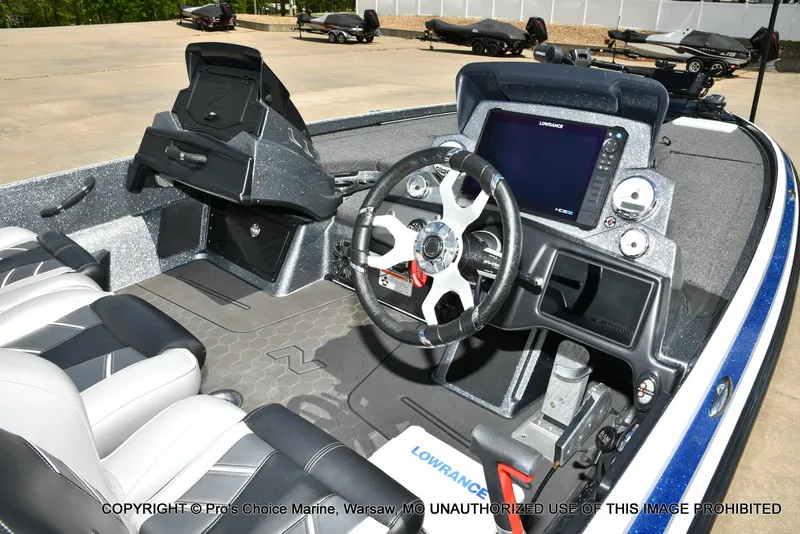 Slide: The Image of 2024 Nitro Z21 XL Pro boat interior with steering wheel and navigation system. - 39