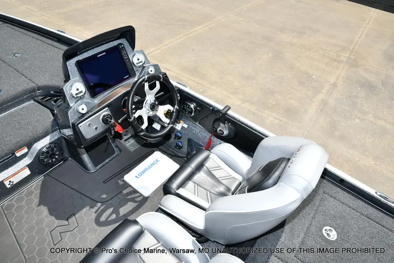 Slide: The Image of 2024 Nitro Z21 XL Pro boat cockpit with steering wheel and navigation display. - 44