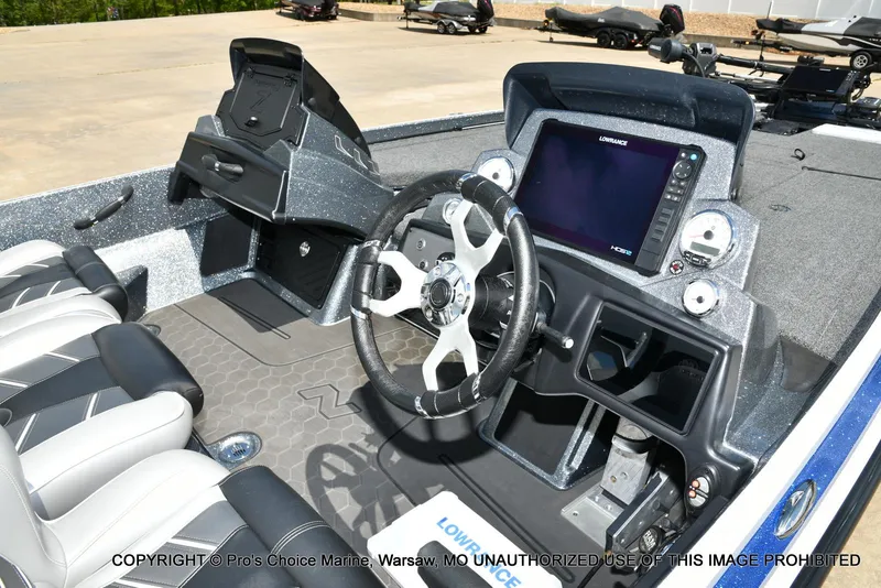 Slide: The Image of 2024 Nitro Z21 XL Pro boat interior with steering wheel and navigation system. - 6