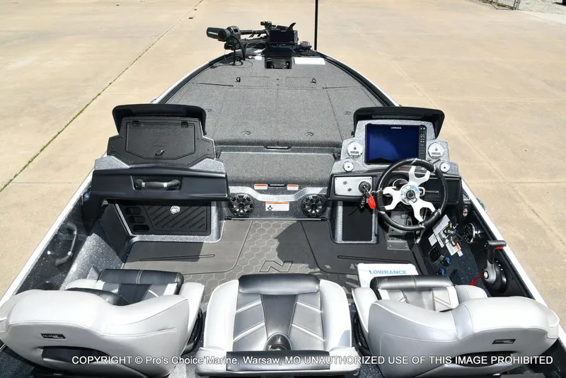 Slide: The Image of 2024 Nitro Z21 XL Pro boat interior with steering wheel and control panel. - 8