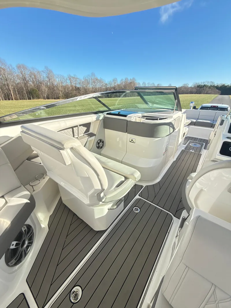 Slide: The Image of 2023 Sea Ray SLX 310 OB boat interior with luxurious seating and modern design. - 15