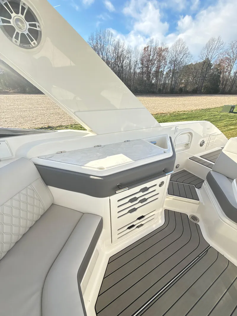 Slide: The Image of 2023 Sea Ray SLX 310 OB boat interior with sleek seating and modern design. - 22