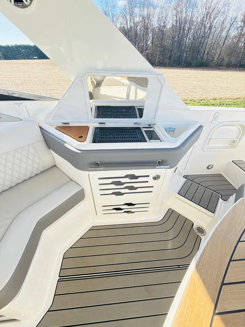 Slide: The Image of 2023 Sea Ray SLX 310 OB interior with sleek seating and modern amenities. - 32