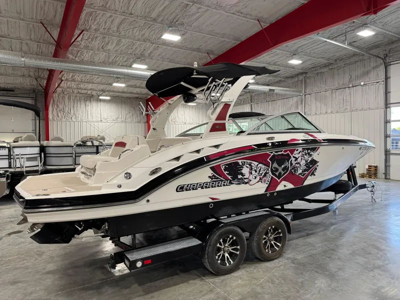 Slide: The Image of 2012 Chaparral 244 EXTREME boat in indoor showroom, side view. - 3
