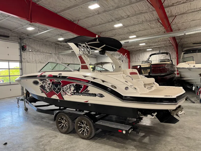 Slide: The Image of 2012 Chaparral 244 EXTREME boat on trailer in indoor storage facility. - 4