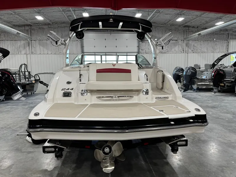 Slide: The Image of 2012 Chaparral 244 EXTREME boat in showroom, rear view with swim platform and propeller. - 5