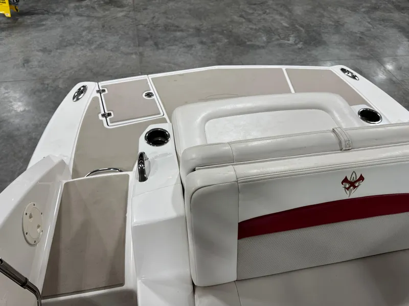Slide: The Image of 2012 Chaparral 244 EXTREME boat interior with white and beige seating. - 7