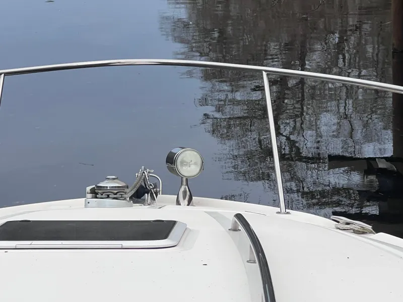 Slide: The Image of Bow of 2004 Sea Ray 320 Sundancer on calm water. - 6