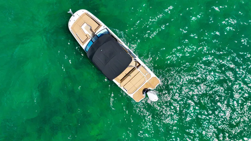 Slide: The Image of Aerial view of 2021 Sea Ray SDX 270 boat on vibrant green water. - 13
