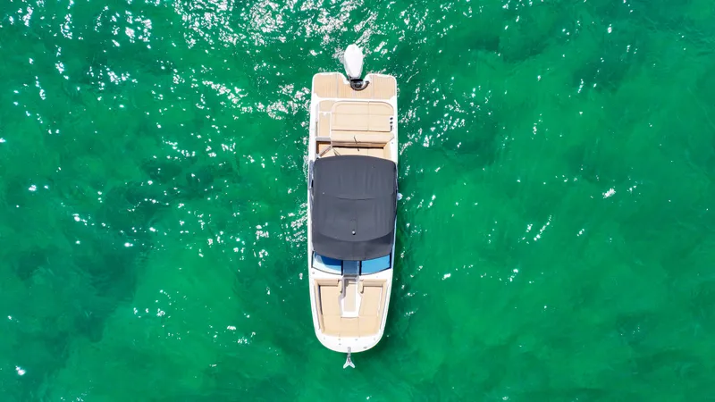 Slide: The Image of Aerial view of 2021 Sea Ray SDX 270 boat on clear turquoise water. - 17
