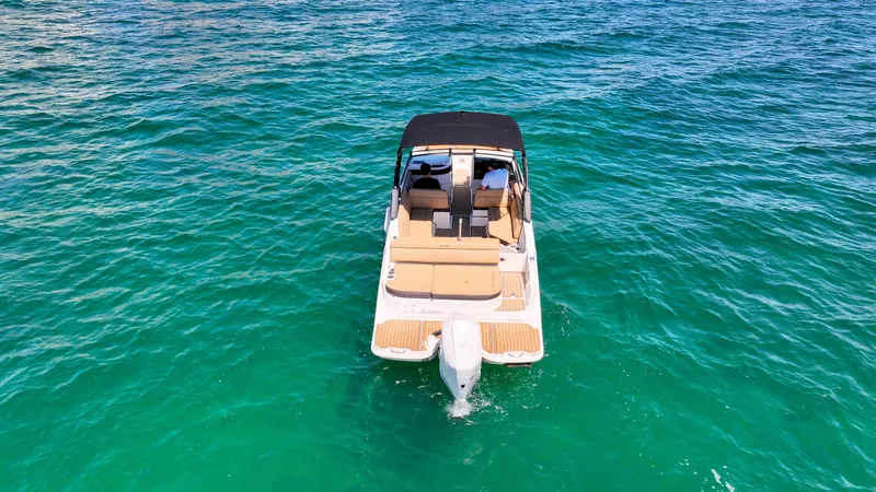 Slide: The Image of 2021 Sea Ray SDX 270 boat on clear turquoise water, viewed from above. - 19