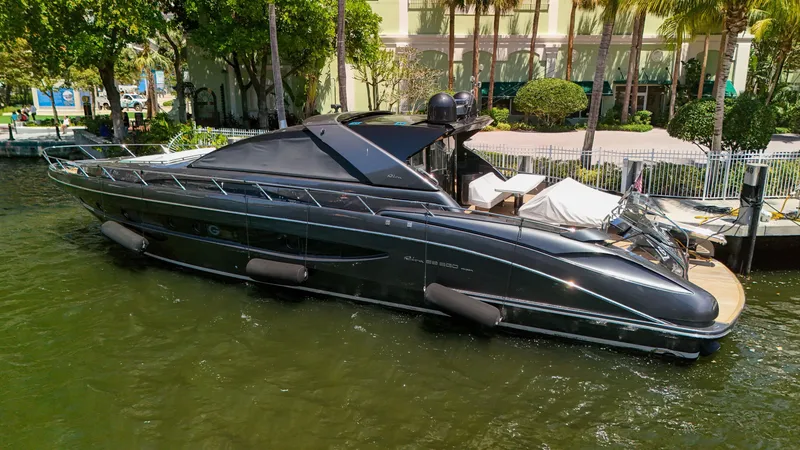 Slide: The Image of 2021 Sea Ray SDX 270 boat docked in a marina, surrounded by lush greenery. - 25