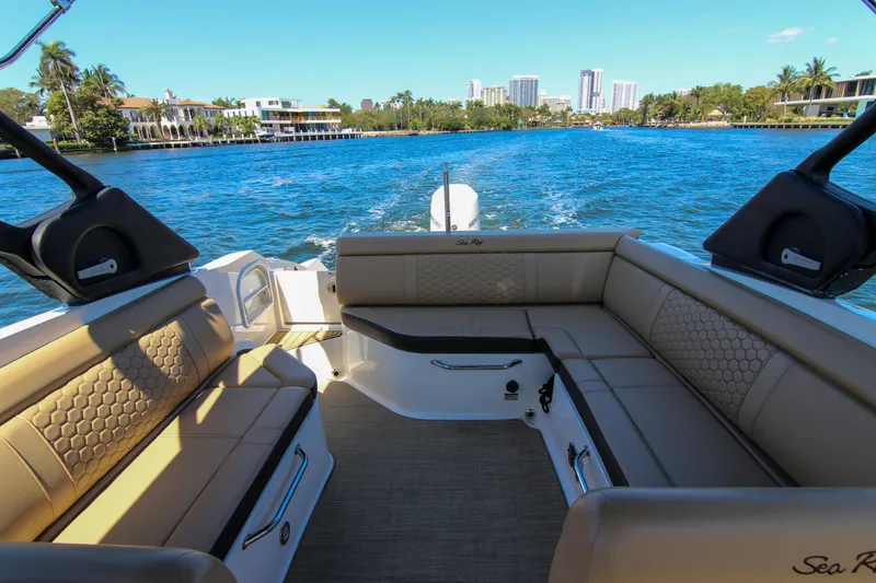 Slide: The Image of 2021 Sea Ray SDX 270 boat interior with luxurious seating on a sunny day. - 33
