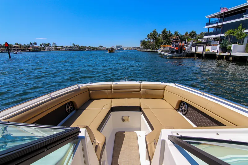 Slide: The Image of 2021 Sea Ray SDX 270 boat cruising on a sunny day, featuring spacious seating. - 40