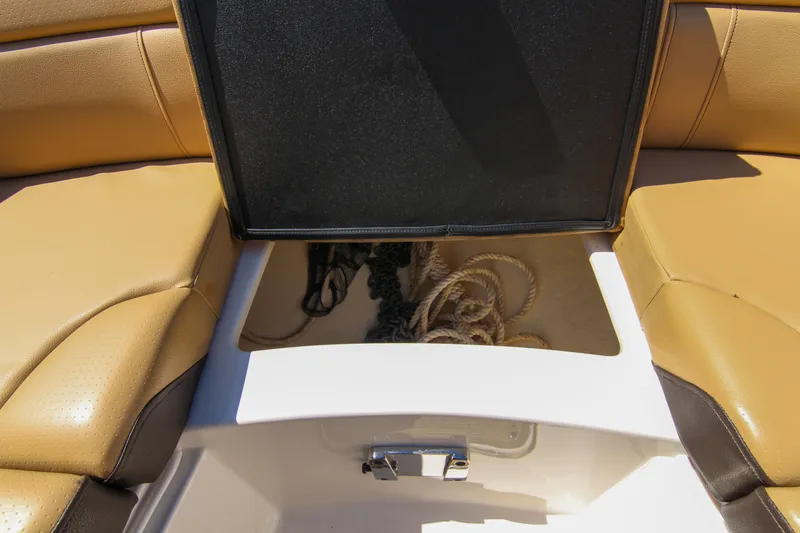 Slide: The Image of Open storage compartment on 2021 Sea Ray SDX 270 boat with ropes inside. - 42