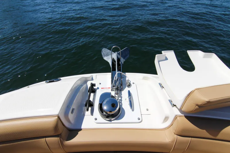 Slide: The Image of 2021 Sea Ray SDX 270 boat deck with anchor, beige seating, and water view. - 43