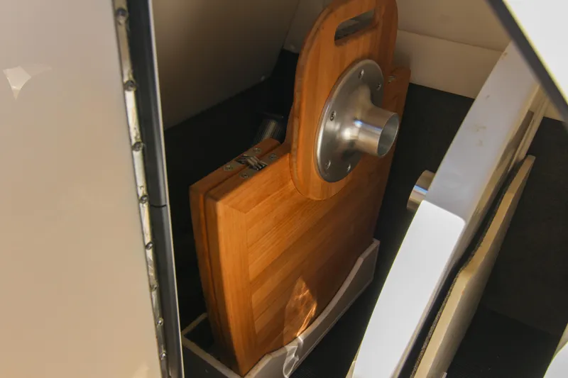 Slide: The Image of Storage compartment in 2021 Sea Ray SDX 270 boat with wooden accessories. - 45