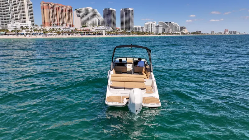 Slide: The Image of 2021 Sea Ray SDX 270 boat on ocean near city skyline. - 8