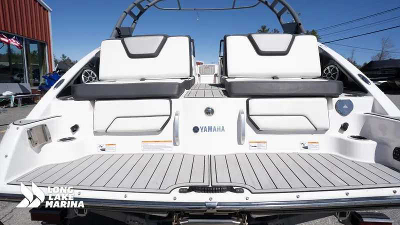 Slide: The Image of 2021 Yamaha Boats 252SE at Long Lake Marina, featuring sleek white seating and deck. - 11