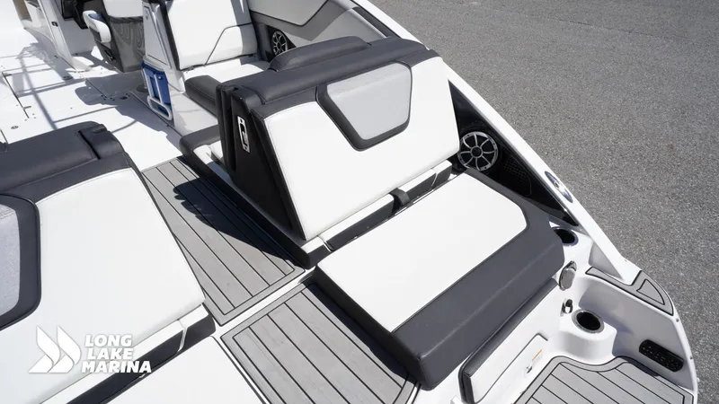 Slide: The Image of 2021 Yamaha Boats 252SE interior with sleek seating and modern design at Long Lake Marina. - 12