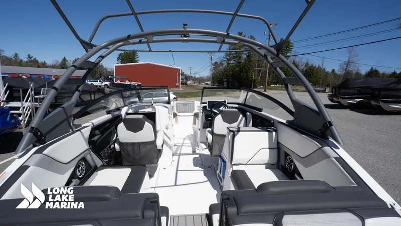 Slide: The Image of 2021 Yamaha Boats 252SE interior at Long Lake Marina, showcasing sleek seating and modern design. - 13