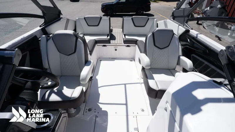 Slide: The Image of 2021 Yamaha Boats 252SE interior with sleek seating at Long Lake Marina. - 16