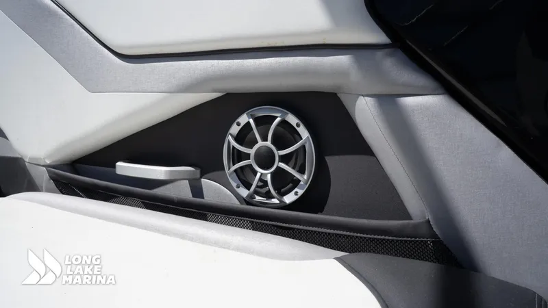 Slide: The Image of Interior speaker detail of 2021 Yamaha Boats 252SE, featuring sleek design and modern audio system. - 22