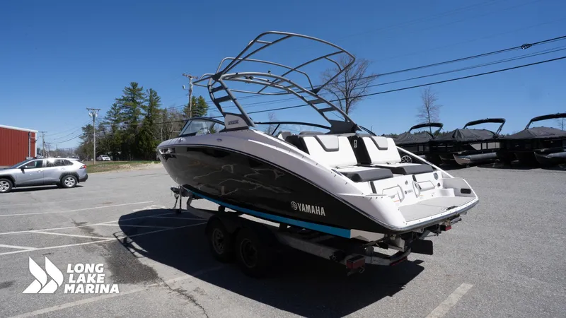 Slide: The Image of 2021 Yamaha Boats 252SE on trailer at Long Lake Marina, clear sky background. - 8