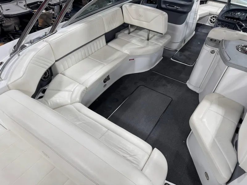 Slide: The Image of 2007 Cobalt 302 BR boat interior with white leather seating and modern design. - 10