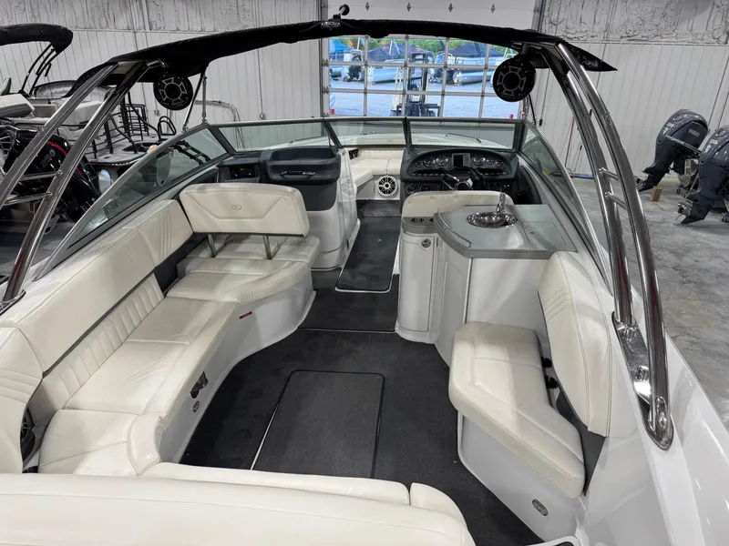 Slide: The Image of 2007 Cobalt 302 BR boat interior with white seating and sleek design. - 13